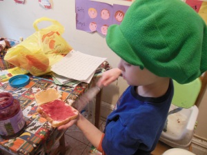 He's helping with the lunch routine, learning how to make the PB and Js.  Love that he wears this green Luigi cap all. the. time.  He's 7 and a half and it's getting real what a big boy he is.